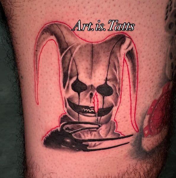 Black & Grey + Horror jester tattoo on Thigh by ArtIsTatts on TattMe