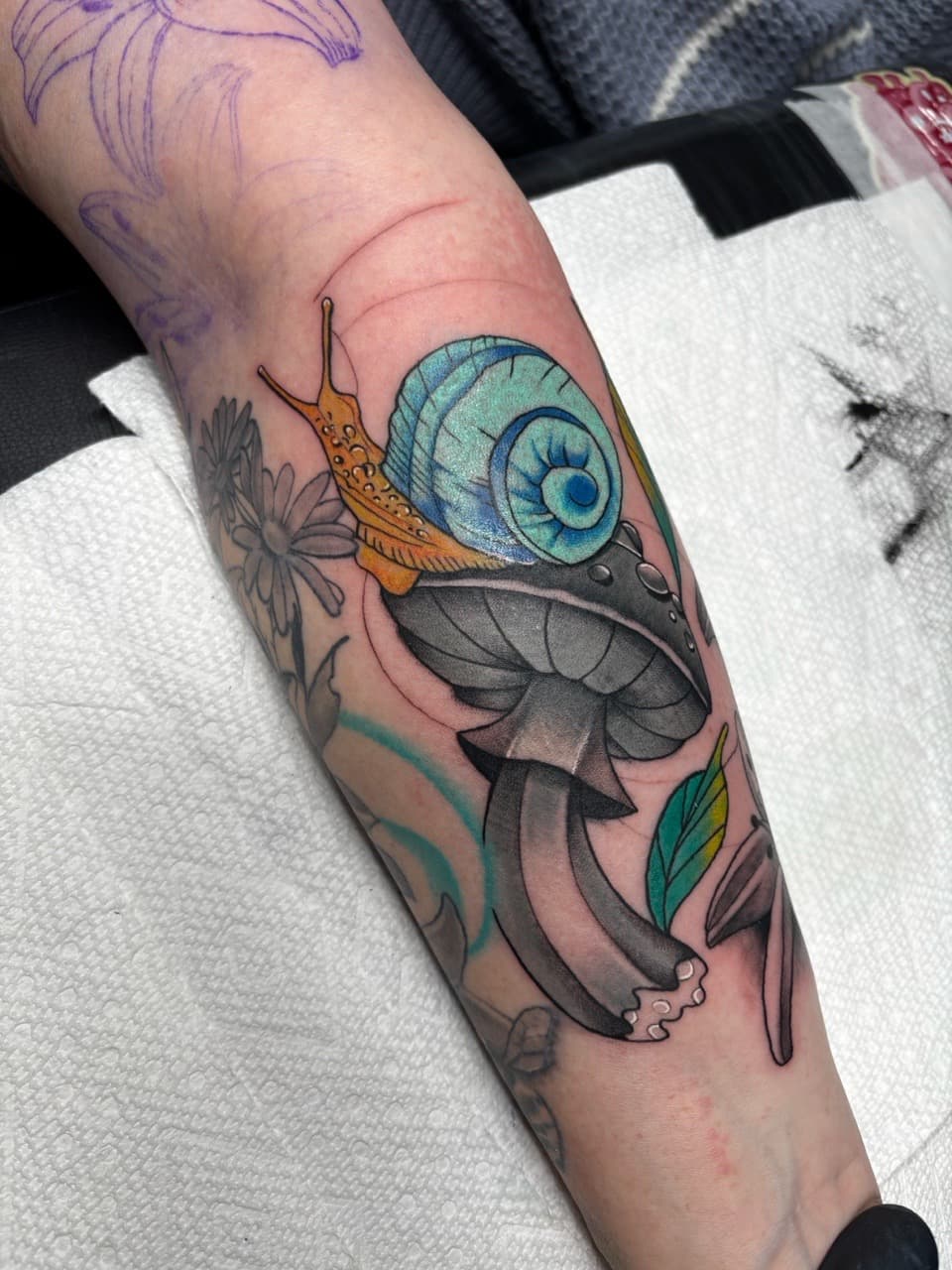 Color + Illustrative snail tattoo on Forearm by Ink_Mob_Studios on TattMe
