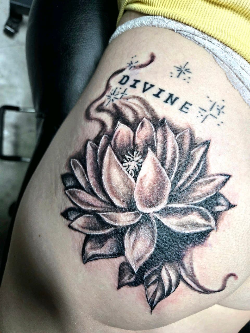 Black & Grey + Floral lotus tattoo on Thigh by Inkytat2z on TattMe