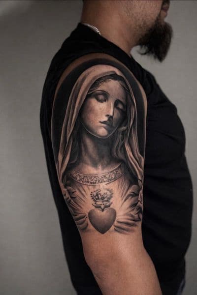 Black & Grey + Realism madonna tattoo on Upper Arm by Lalo_Ink_Tattoo on TattMe