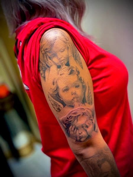 Black & Grey + Realism cherubs tattoo on Upper Arm by Lalo_Ink_Tattoo on TattMe
