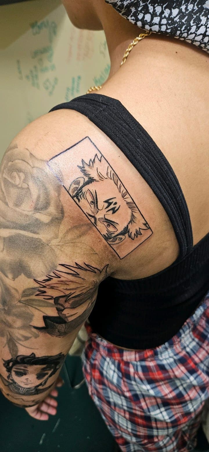 Anime + Black & Grey face tattoo on Upper Arm by 2nd_Circle_Tattoo_Co on TattMe