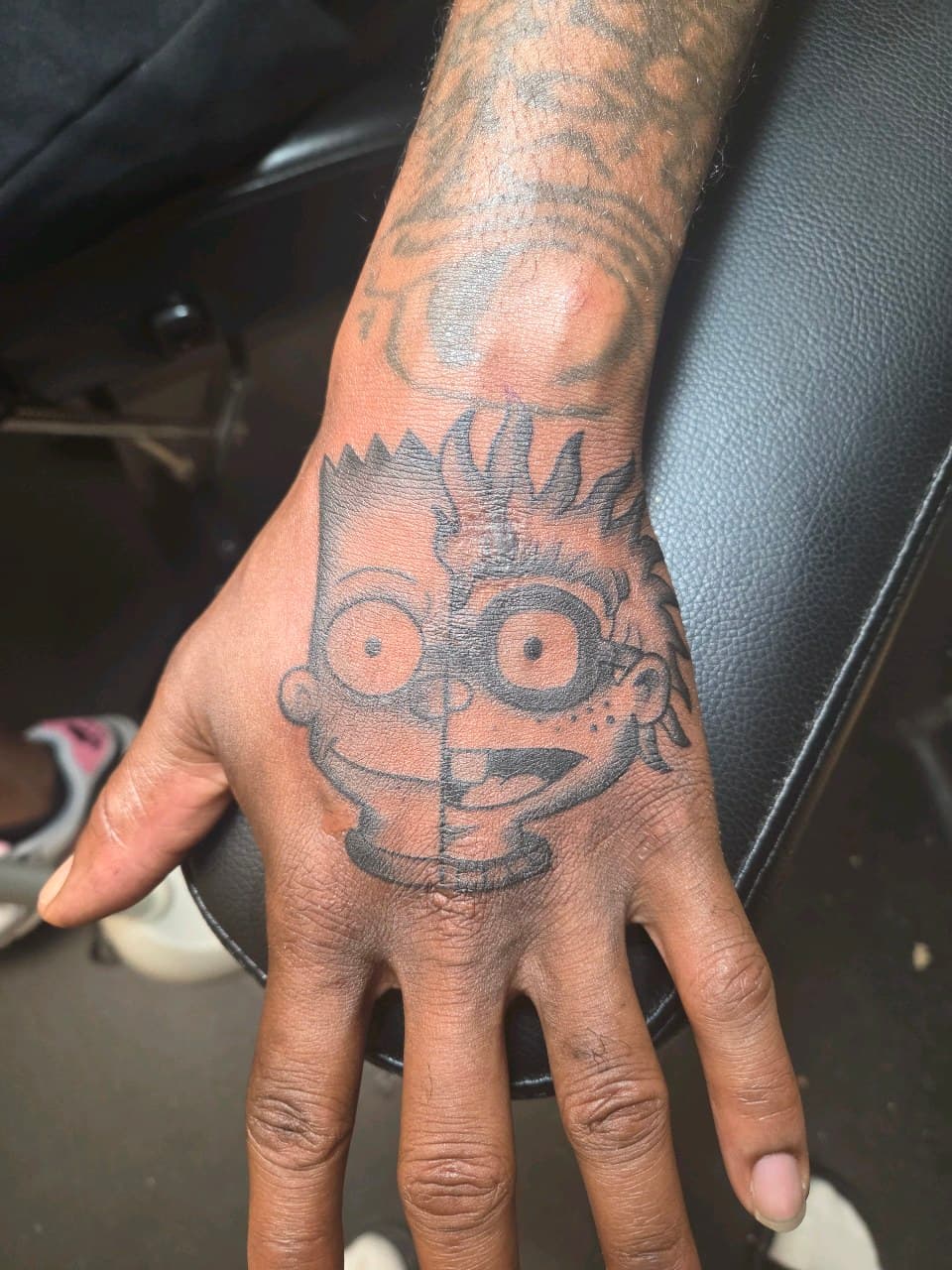 Black-work + Cartoon bart simpson tattoo on Hand by 2nd_Circle_Tattoo_Co on TattMe