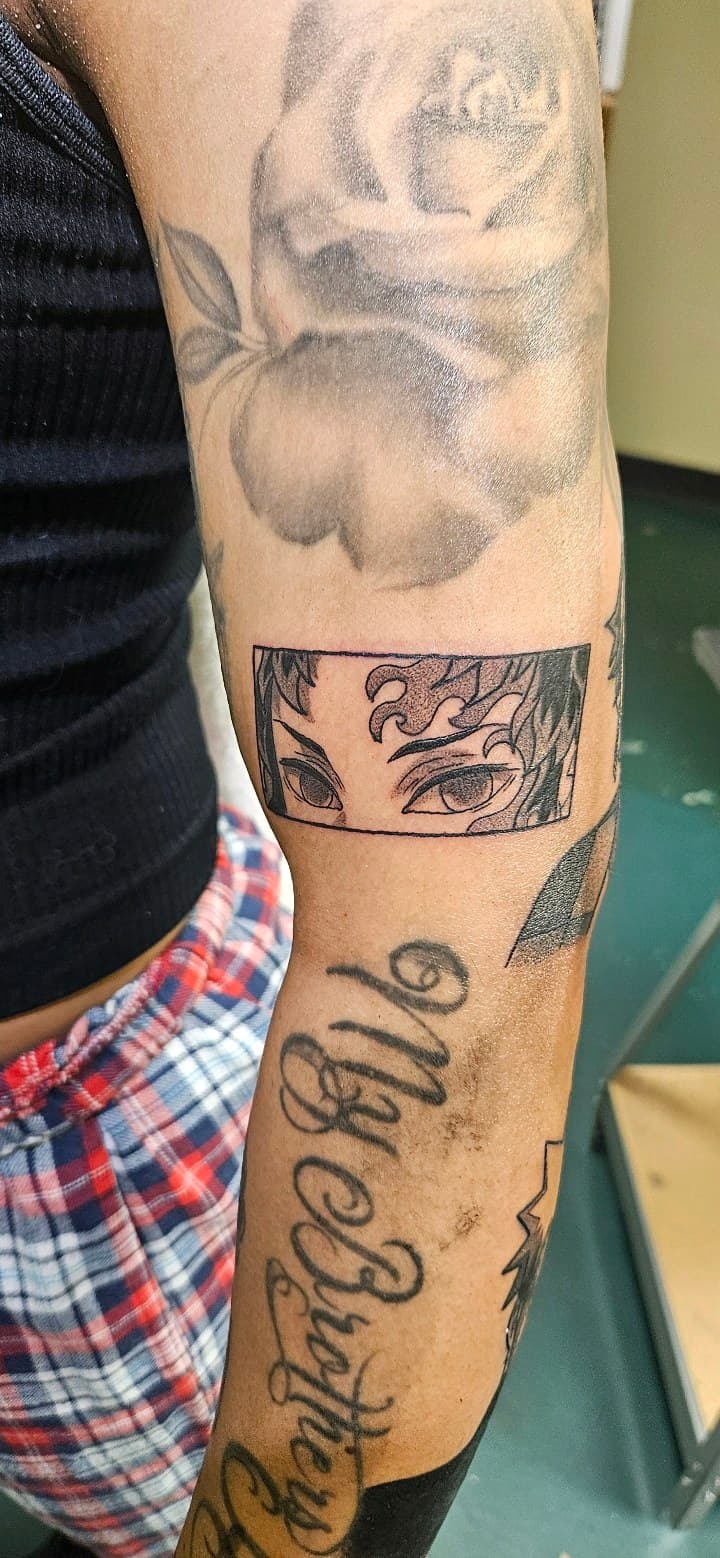 Anime + Black & Grey eyes tattoo on Upper Arm by 2nd_Circle_Tattoo_Co on TattMe