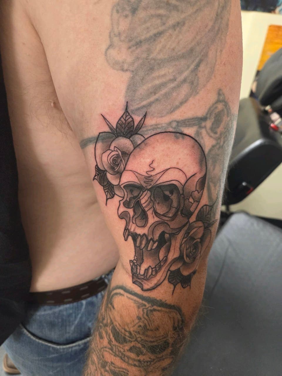 Black & Grey + Illustrative skull tattoo on Upper Arm by 2nd_Circle_Tattoo_Co on TattMe
