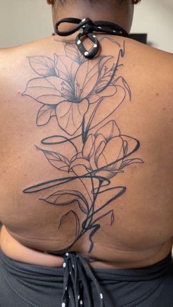 Fine Line + Floral flowers tattoo on Upper Back by inkboiz on TattMe