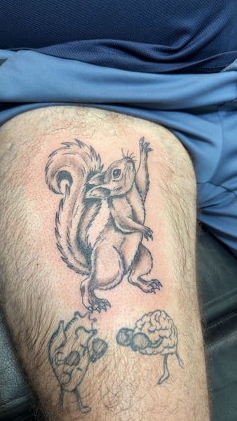 Black & Grey + Illustrative squirrel tattoo on Thigh by inkboiz on TattMe