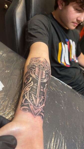 Black & Grey + Tribal arrow tattoo on Forearm by inkboiz on TattMe