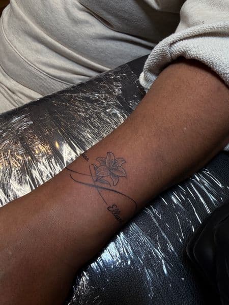 Fine Line + Floral lily tattoo on Forearm by inkboiz on TattMe
