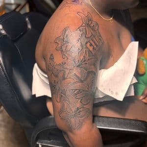 Black & Grey + Floral flowers tattoo on Upper Arm by 32_Incc_STUDIOS_LLC. on TattMe