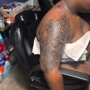 Floral + Black & Grey flowers tattoo on Upper Arm by 32_Incc_STUDIOS_LLC. on TattMe