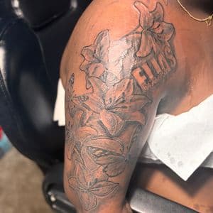 Black & Grey + Floral flowers tattoo on Upper Arm by 32_Incc_STUDIOS_LLC. on TattMe