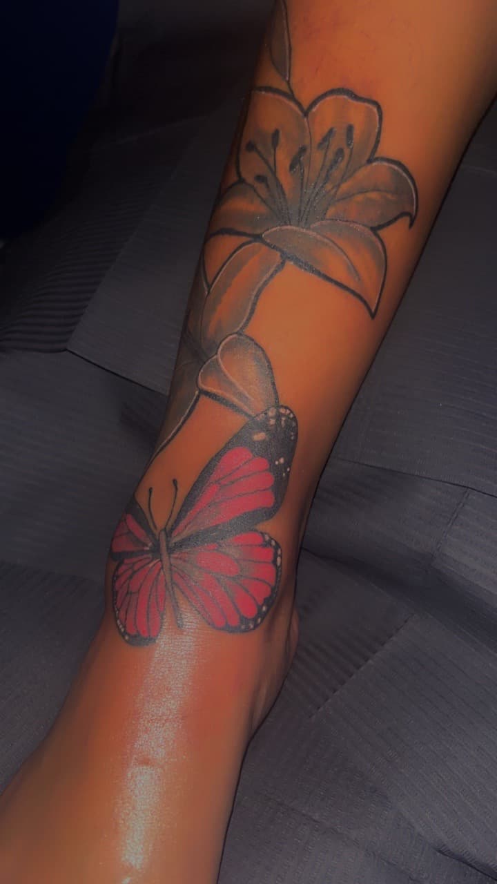 Floral + Color butterfly tattoo on Ankle by 32_Incc_STUDIOS_LLC. on TattMe