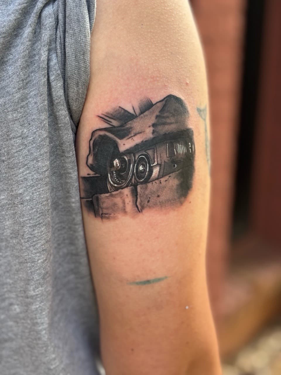 Black & Grey + Illustrative car tattoo on Upper Arm by Brogan_Tattoos on TattMe