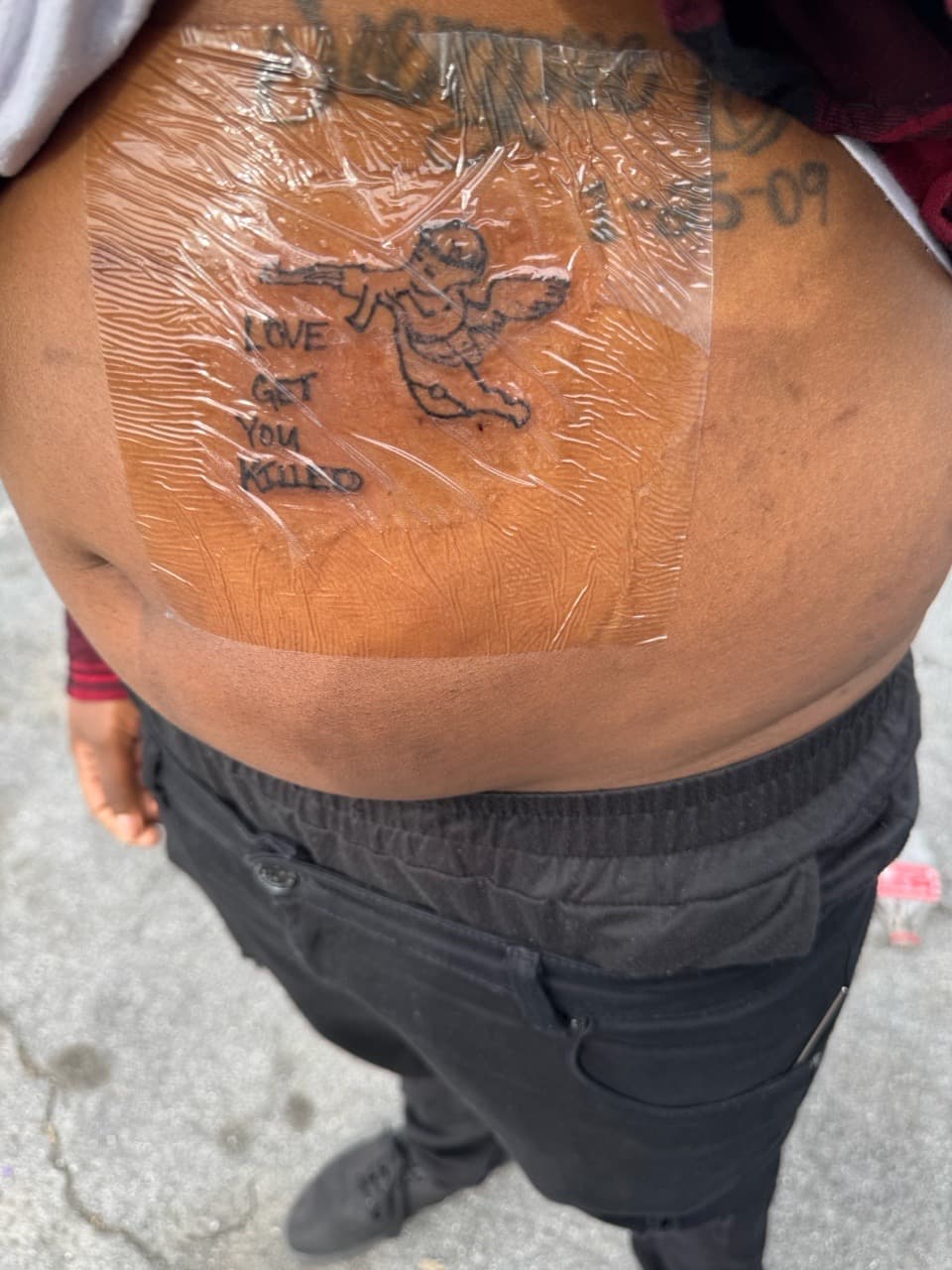 Black & Grey + Lettering cupid tattoo on Stomach by SynSity_Inkz on TattMe
