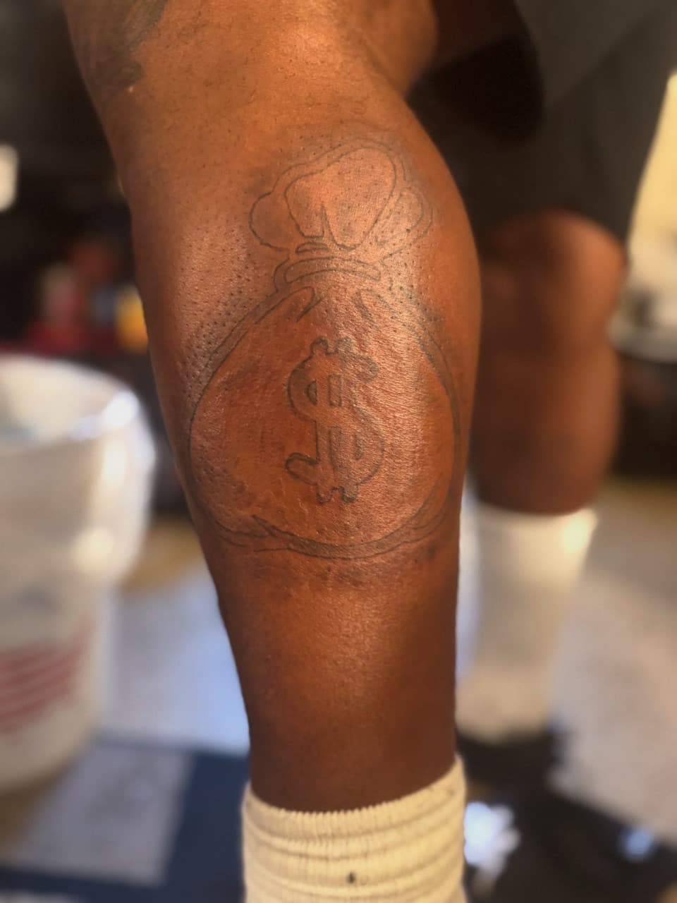 Line-work + Minimalist money bag tattoo on Calf by SynSity_Inkz on TattMe