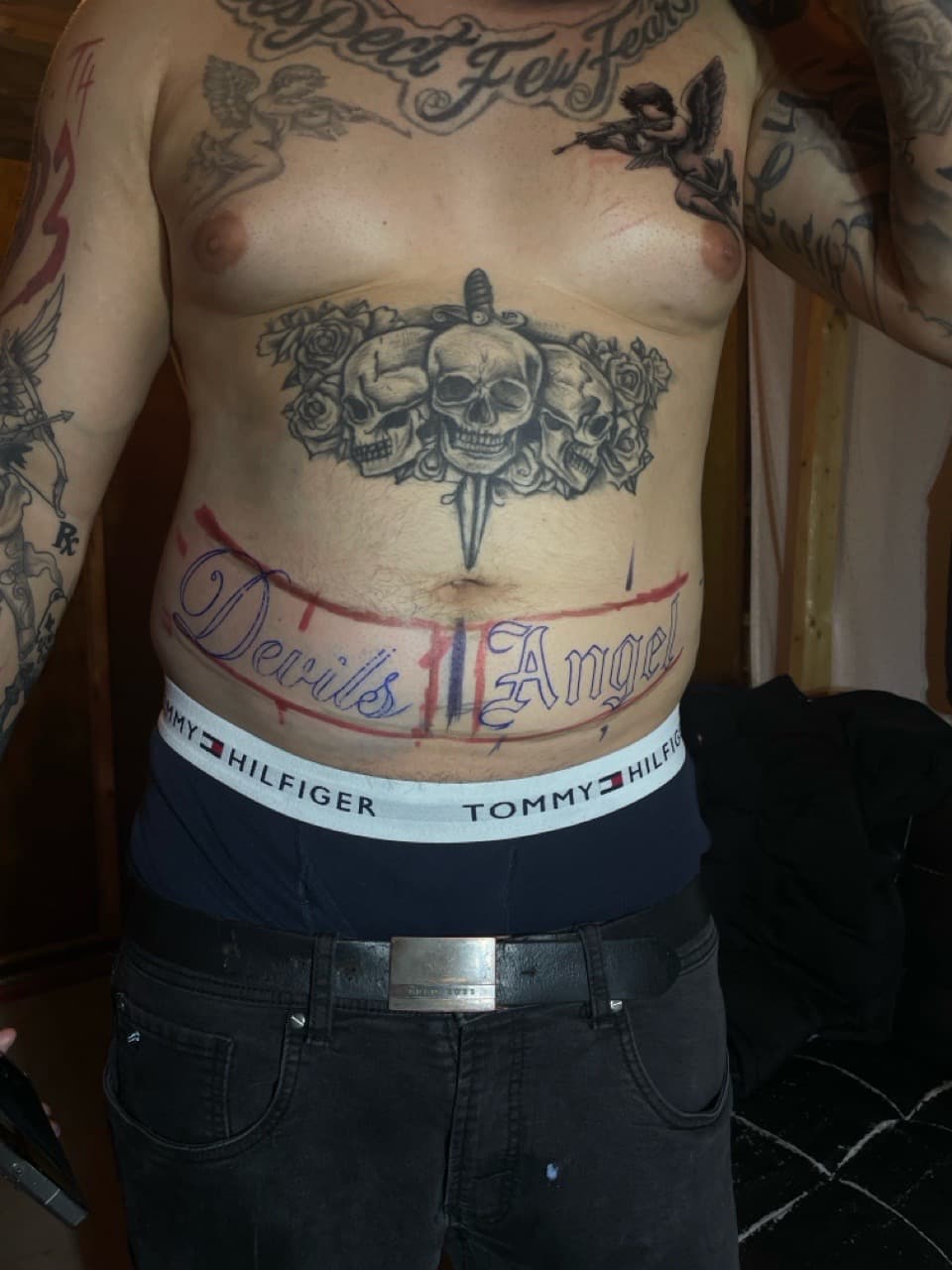 Black & Grey + Lettering skulls tattoo on Stomach by Pain_Ink on TattMe