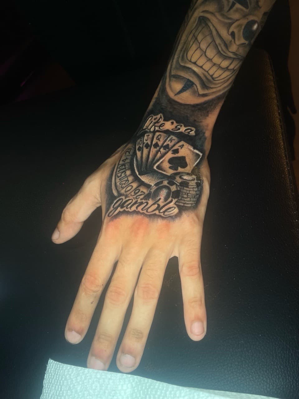 Black & Grey + Lettering gambling tattoo on Hand by Pain_Ink on TattMe