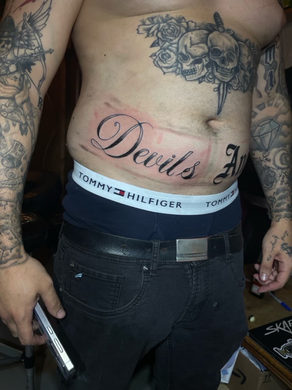 Lettering + Script skulls tattoo on Stomach by Pain_Ink on TattMe