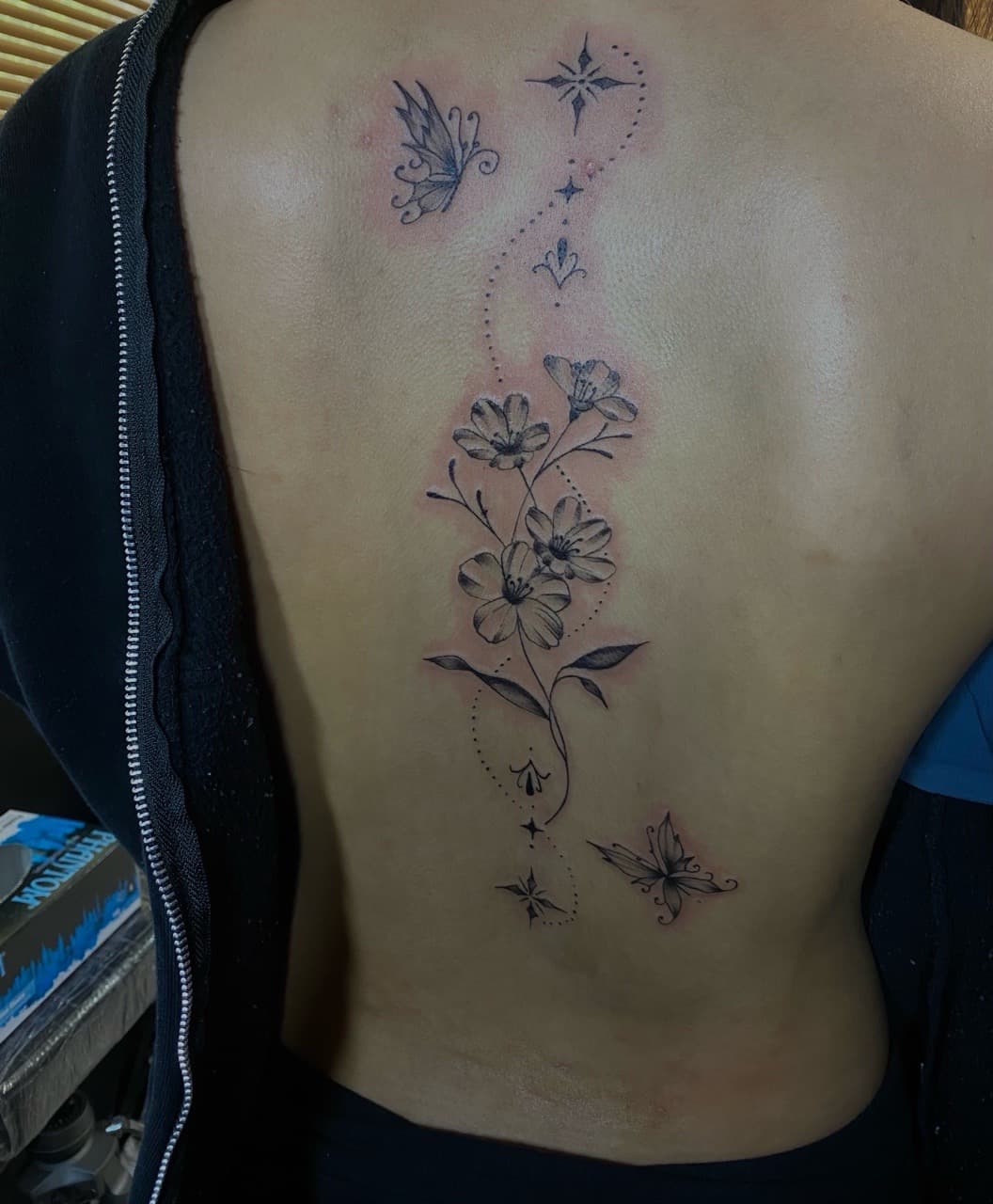 Fine Line + Black & Grey flowers tattoo on Spine by Pretty_In_Ink on TattMe