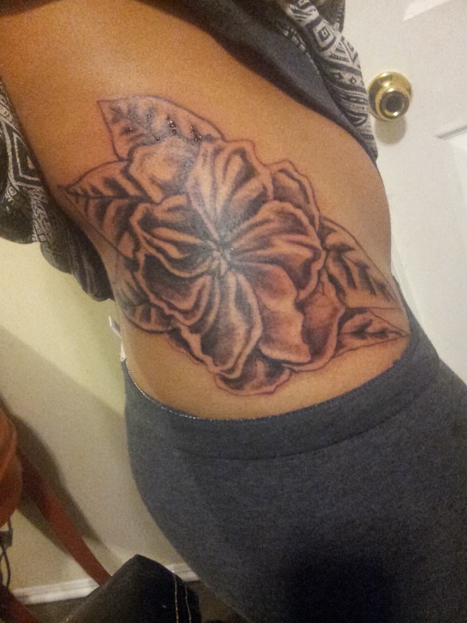 Black & Grey + Floral flower tattoo on Ribs by Tattsbygxd on TattMe