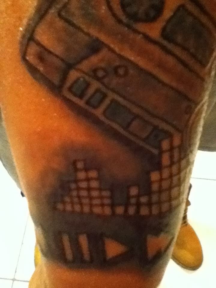 Black-work + Line-work cassette tattoo on Upper Arm by Tattsbygxd on TattMe