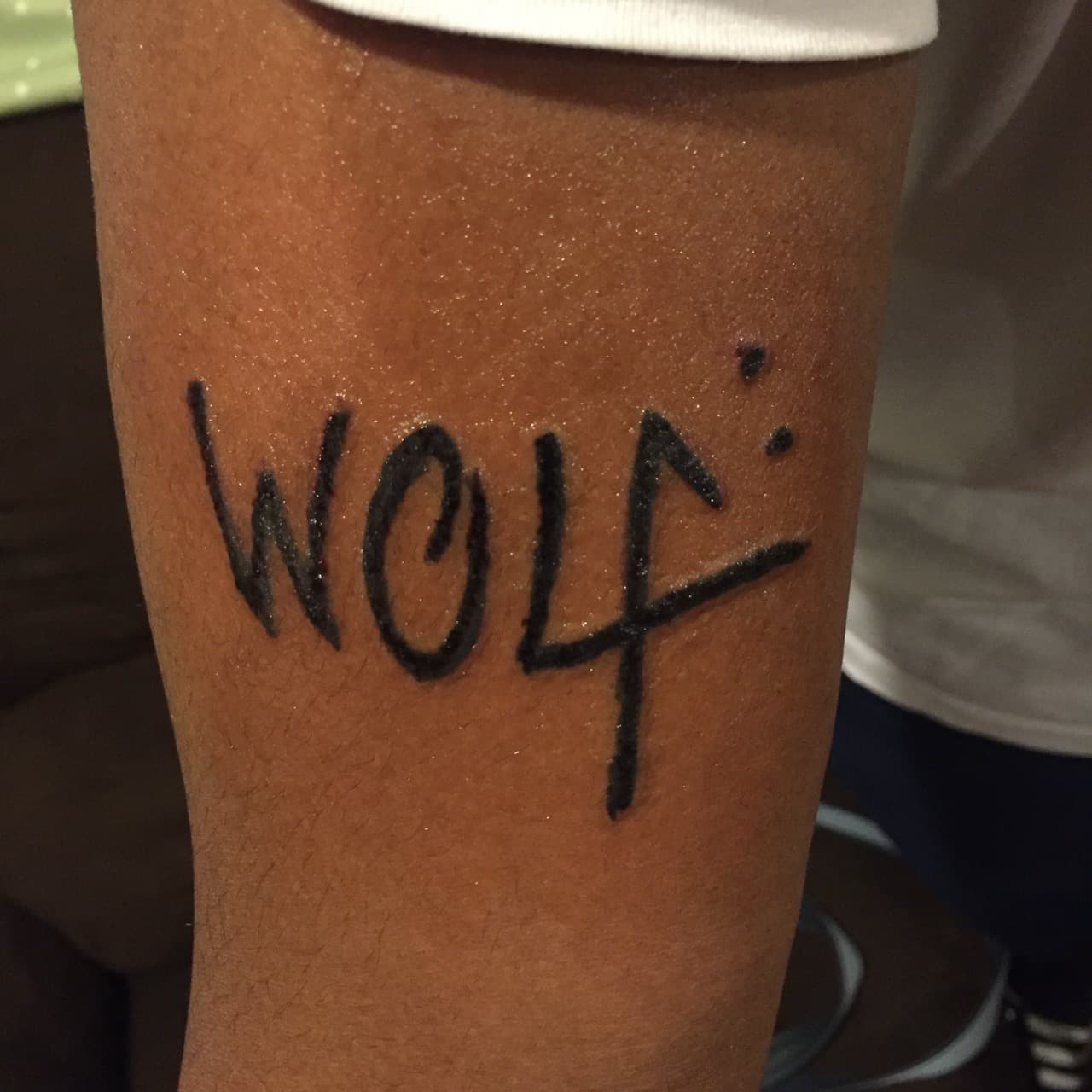 Lettering + Black-work wolf tattoo on Upper Arm by Tattsbygxd on TattMe