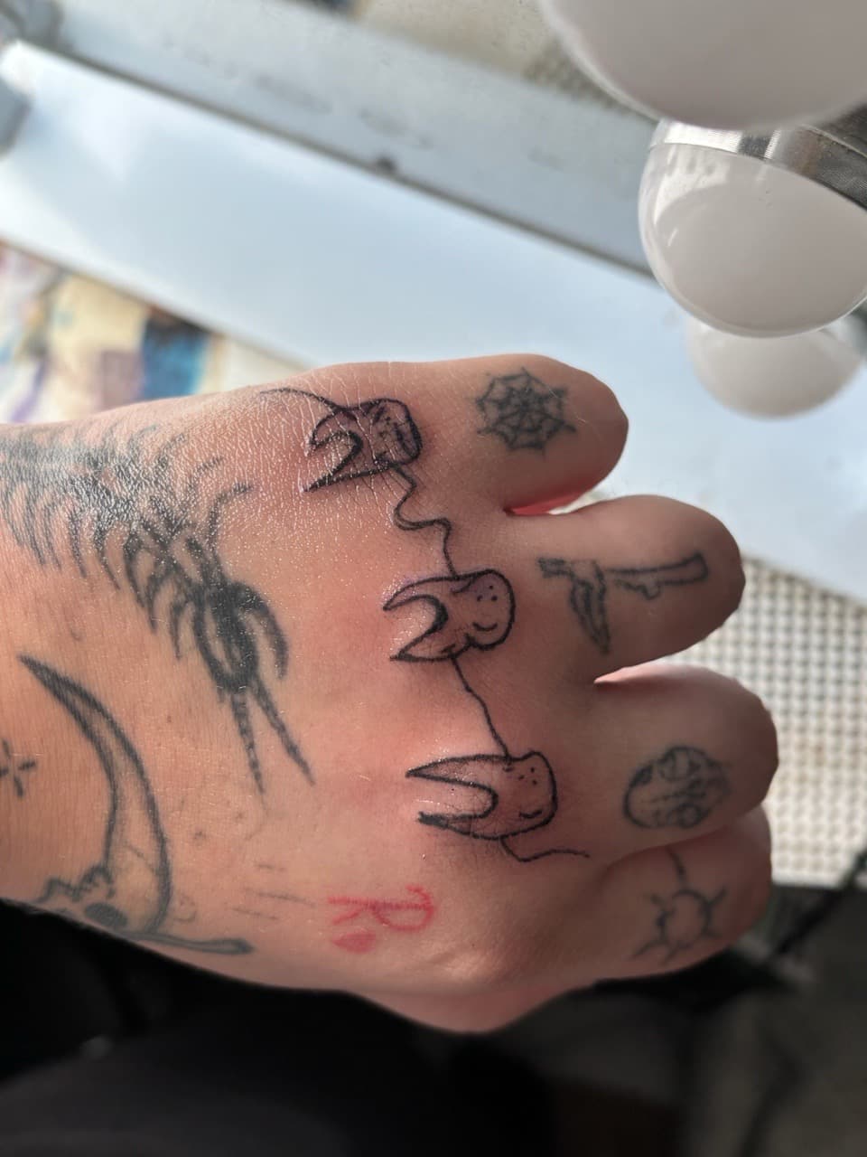 Stick & Poke + Black-work teeth tattoo on Foot by oaktreetattoos on TattMe