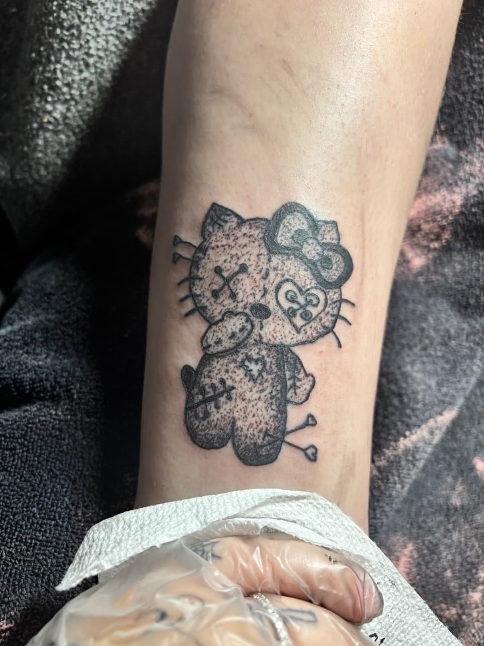 Black & Grey + Dot-work hello kitty tattoo on Calf by oaktreetattoos on TattMe