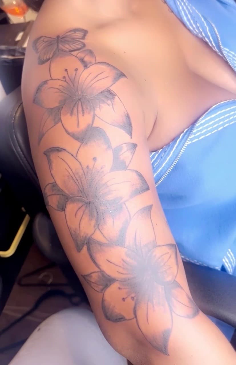 Floral + Black & Grey flowers tattoo on Upper Arm by inkedbyk on TattMe