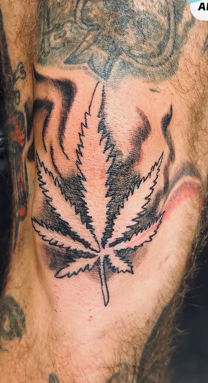 Illustrative + Black & Grey cannabis leaf tattoo on Neck (Front) by Taking_Art_2_The_Streets on TattMe