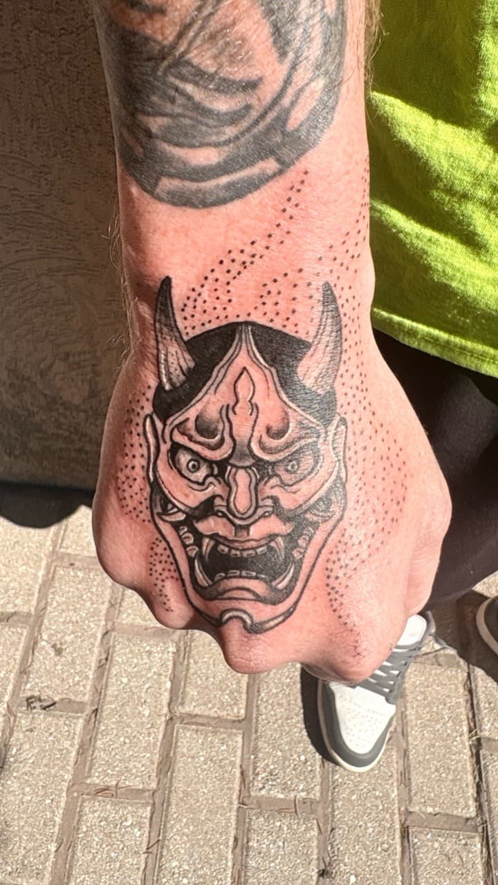 Black & Grey + Japanese hannya mask tattoo on Hand by Taking_Art_2_The_Streets on TattMe
