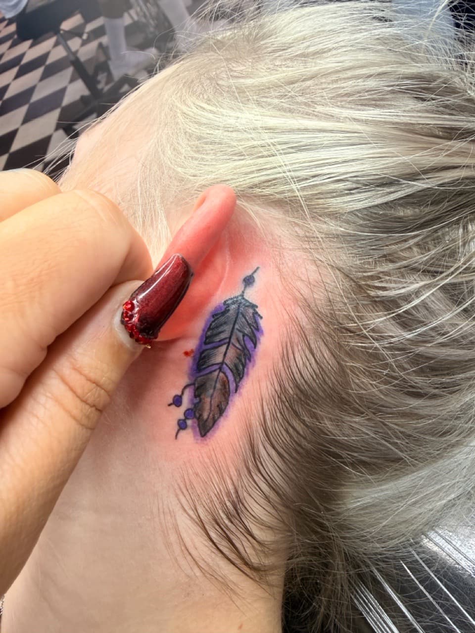 Illustrative + Color feather tattoo on Behind Ear by Lex on TattMe