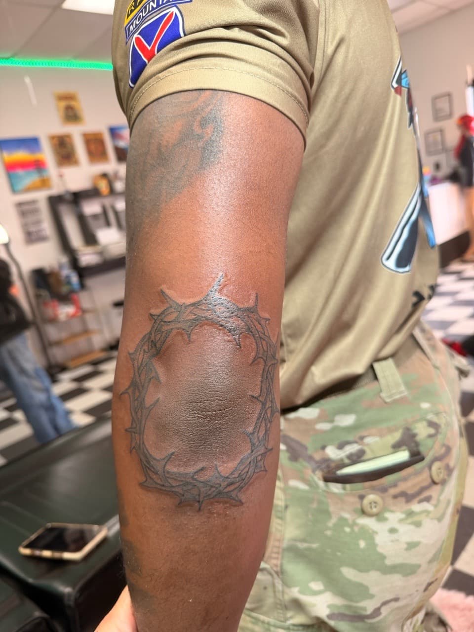 Line-work + Black-work crown tattoo on Elbow by Lex on TattMe