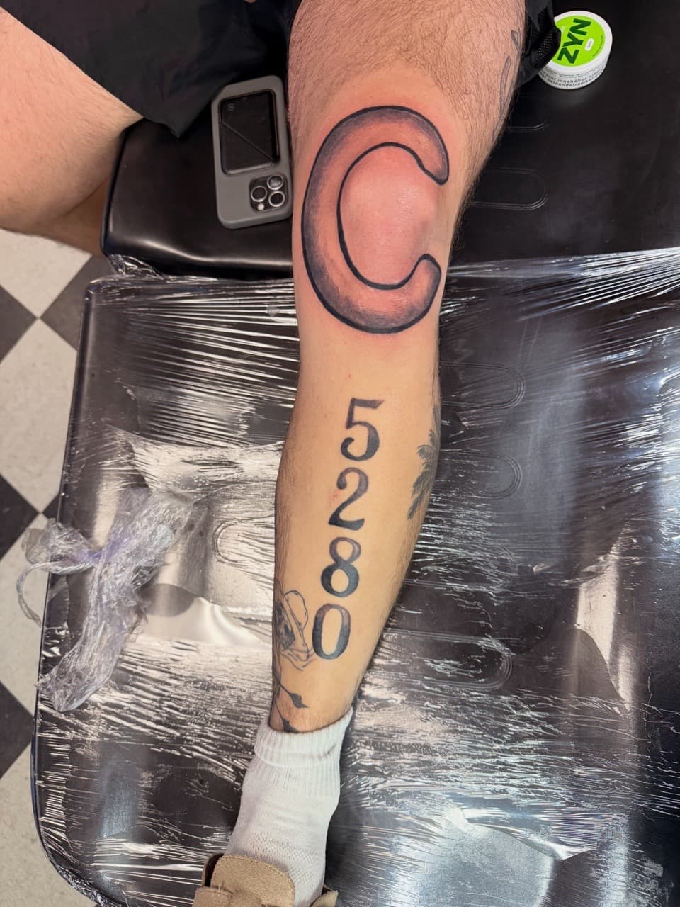 Black & Grey + Lettering letter c tattoo on Knee by Lex on TattMe