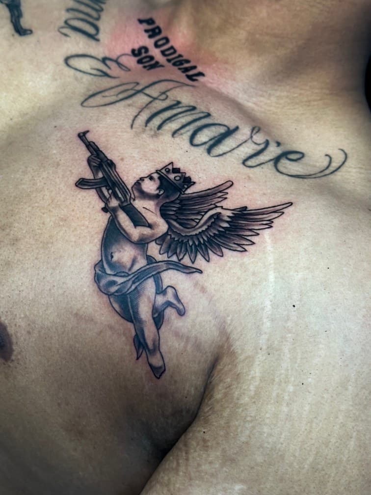 Black & Grey + Illustrative angel tattoo on Chest by Trevion on TattMe