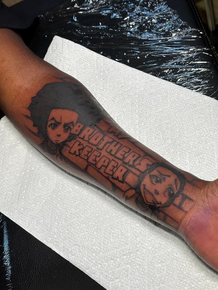 Pop Culture + Black & Grey boondocks tattoo on Forearm by Trevion on TattMe