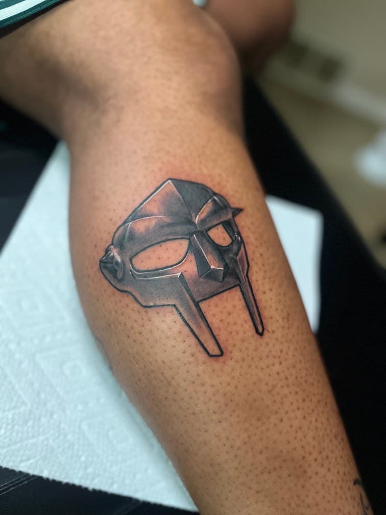 Black & Grey + Illustrative mask tattoo on Calf by Trevion on TattMe