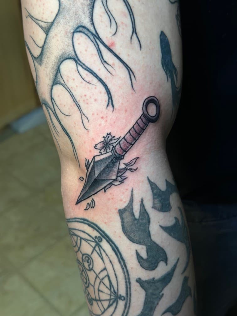 Anime + Illustrative kunai tattoo on Upper Arm by Trevion on TattMe