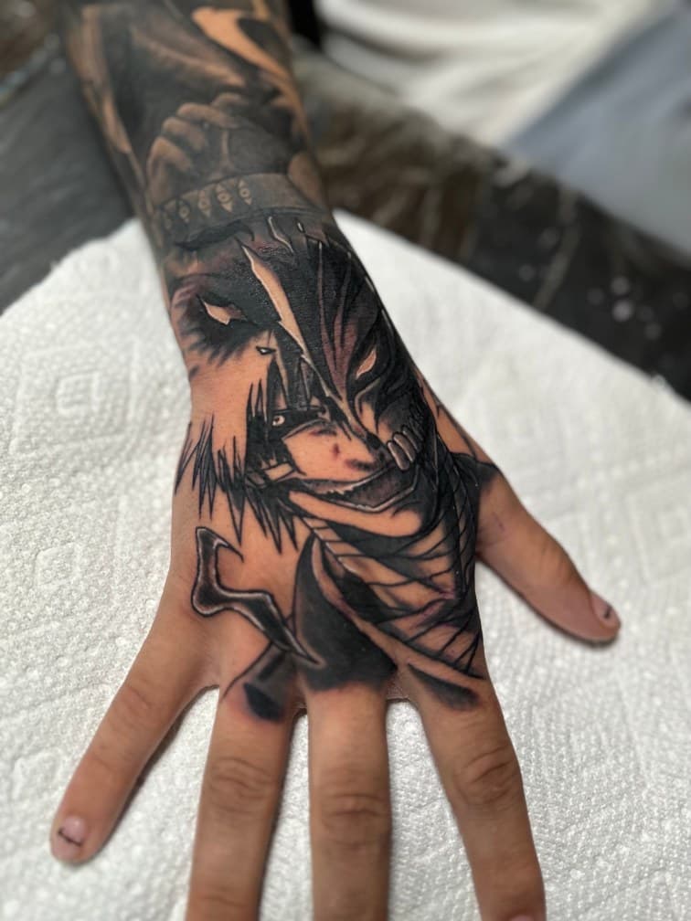 Black & Grey + Anime mask tattoo on Hand by Trevion on TattMe