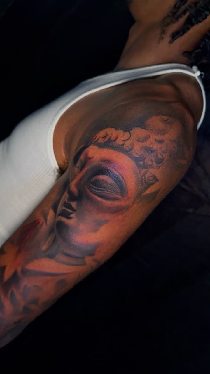 Realism + Illustrative Realism buddha tattoo on Upper Arm by kiddd_ink on TattMe