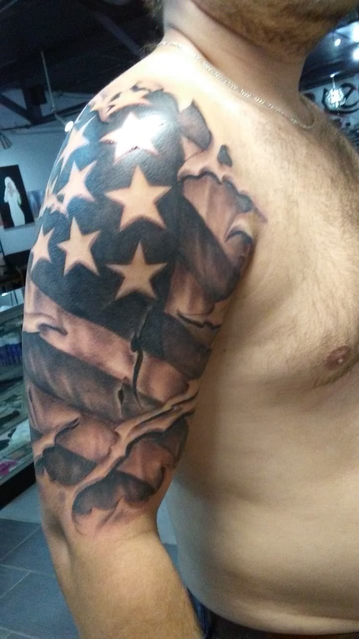 Black & Grey + Realism american flag tattoo on Upper Arm by Tattoos_By_Kev_TBK on TattMe