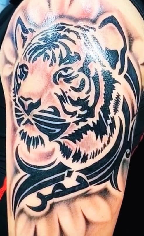 Black & Grey + Tribal tiger tattoo on Upper Arm by KD_INKORPORATED on TattMe