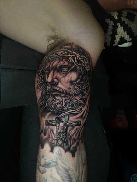 Realism + Black & Grey jesus tattoo on Upper Arm by KD_INKORPORATED on TattMe