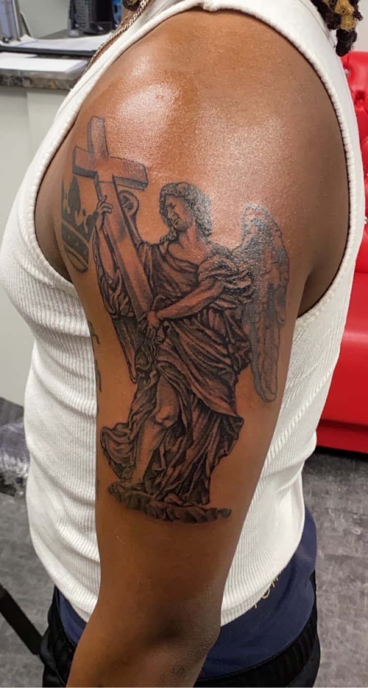 Black & Grey + Religious angel tattoo on Upper Arm by KD_INKORPORATED on TattMe