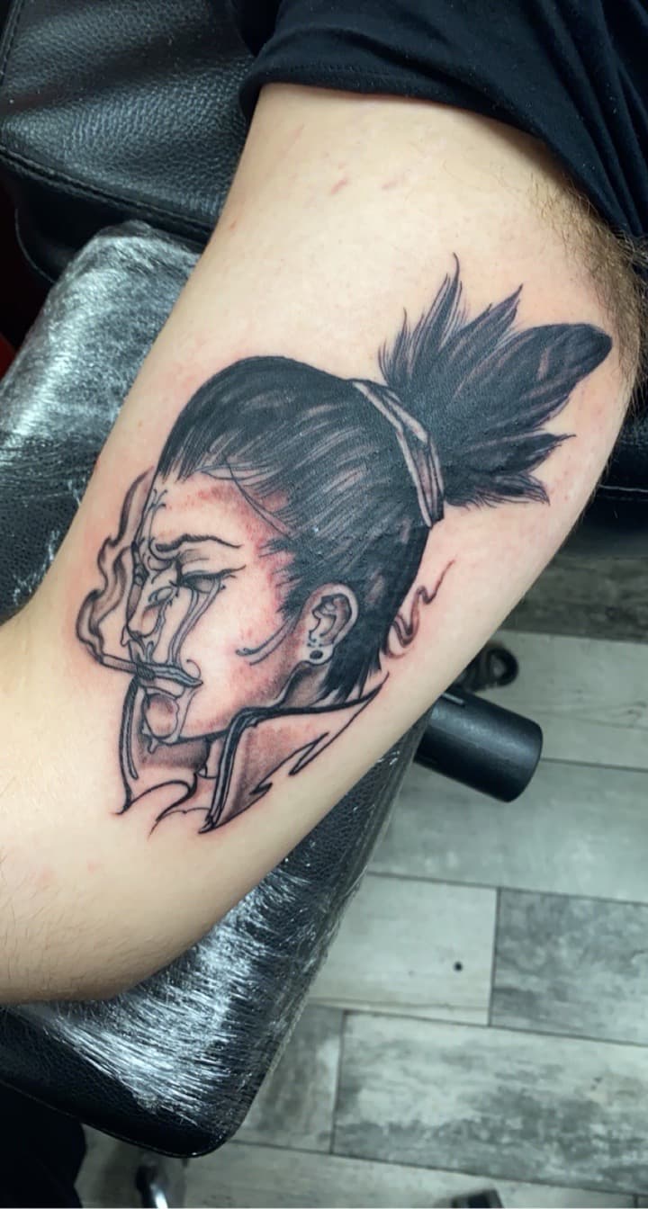 Black & Grey + Illustrative smoke tattoo on Upper Arm by KD_INKORPORATED on TattMe