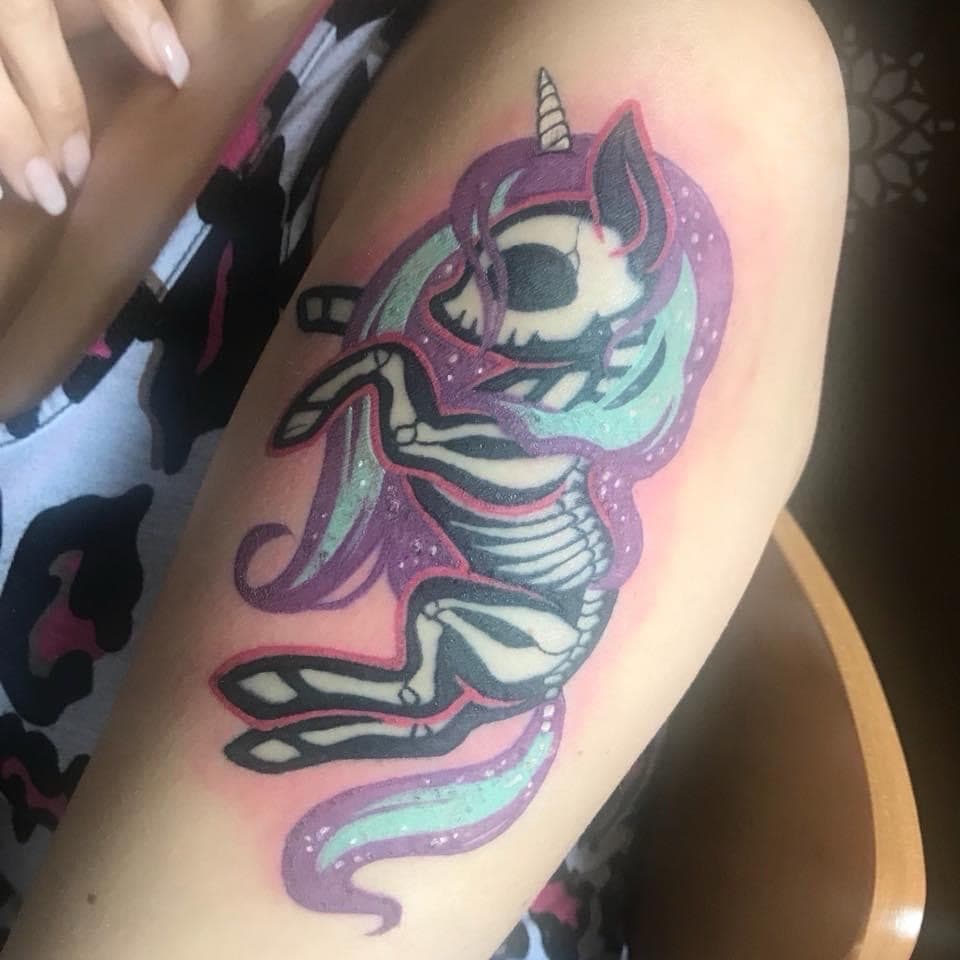 Color + Illustrative unicorn tattoo on Upper Arm by Inksworth on TattMe