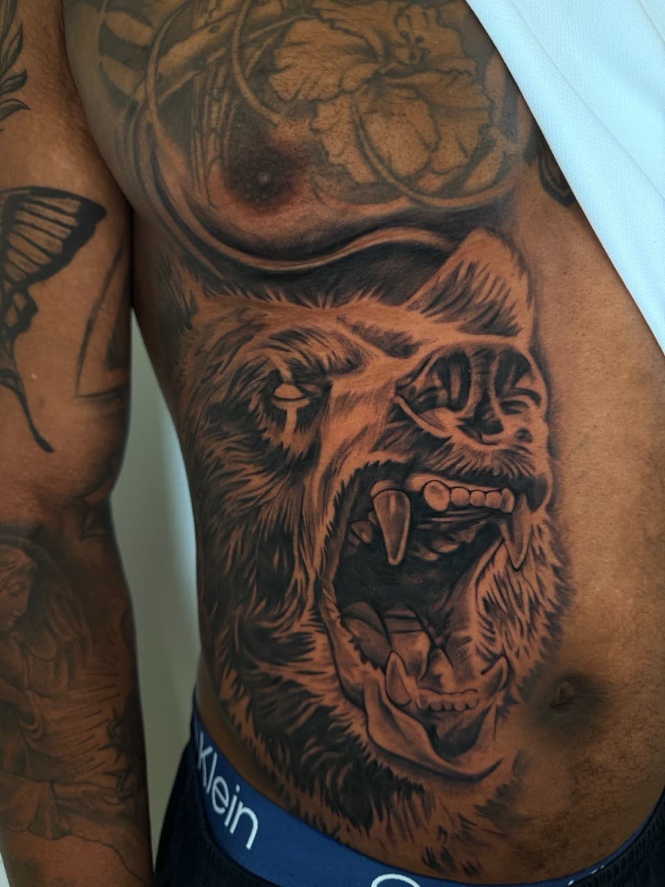 Black & Grey + Realism bear tattoo on Ribs by Upside_Tattoo on TattMe