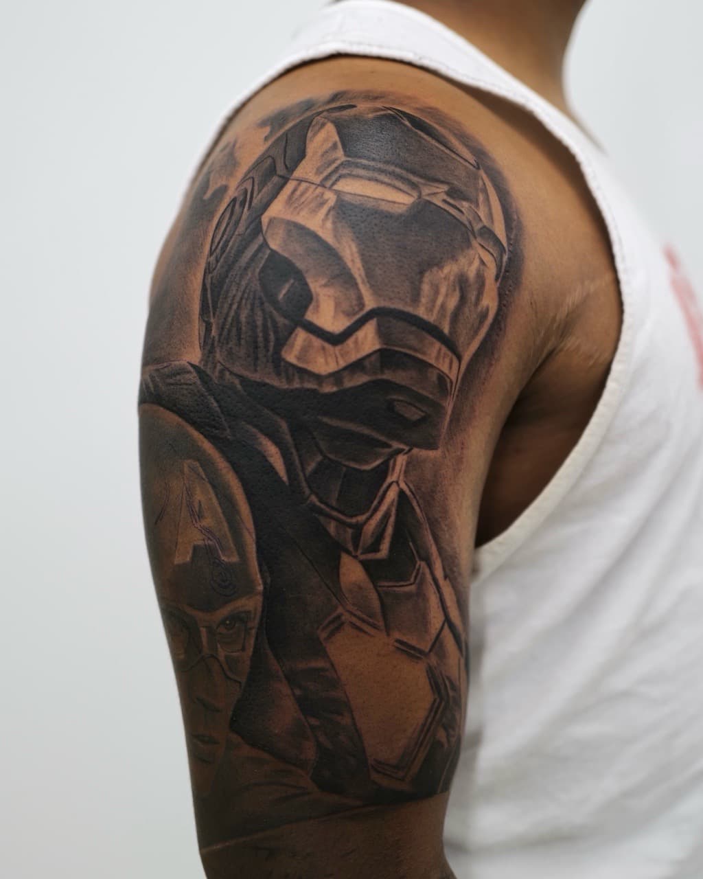 Black & Grey + Realism iron man tattoo on Upper Arm by Upside_Tattoo on TattMe