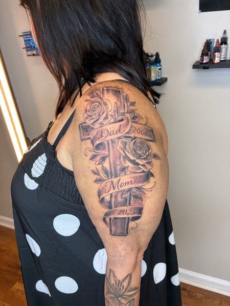 Black & Grey + Illustrative cross tattoo on Upper Arm by Bizzarreink on TattMe